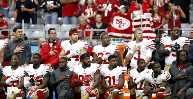 [ 49ers taking knee pic ]